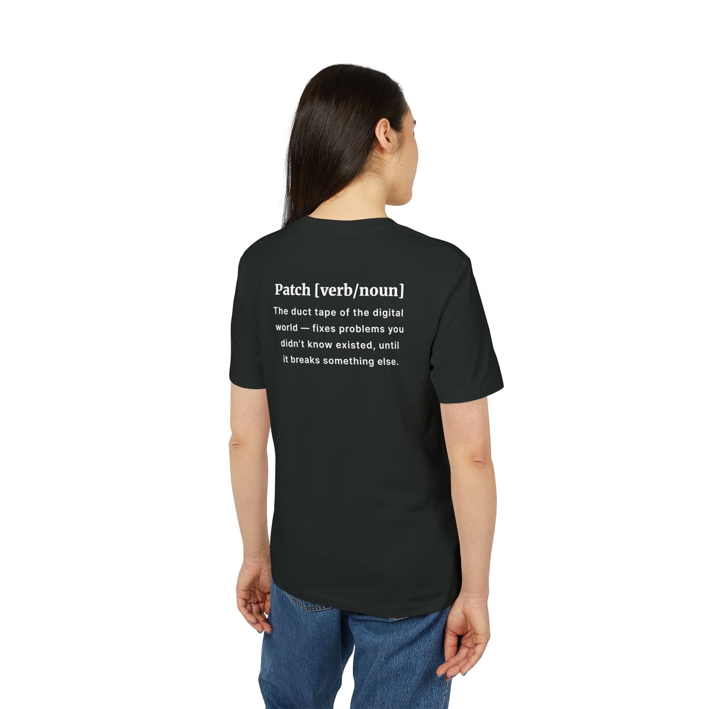 Person wearing a black t-shirt with text on the back, standing against a white background