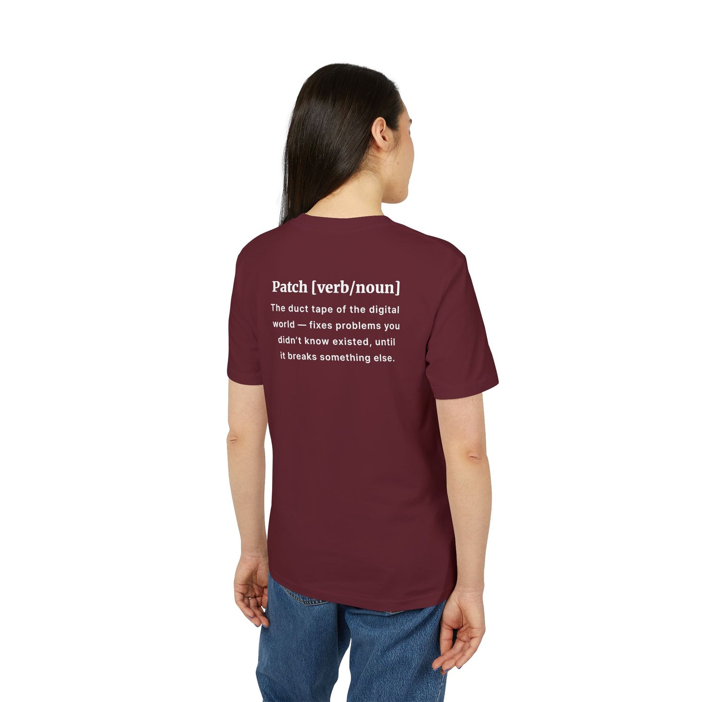 Person wearing a maroon t-shirt with text on the back, standing against a white background