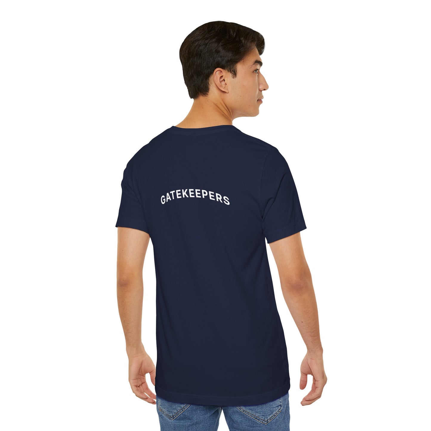 Man wearing a navy blue t-shirt with 'GATEKEEPERS' text on the back, standing against a white background.