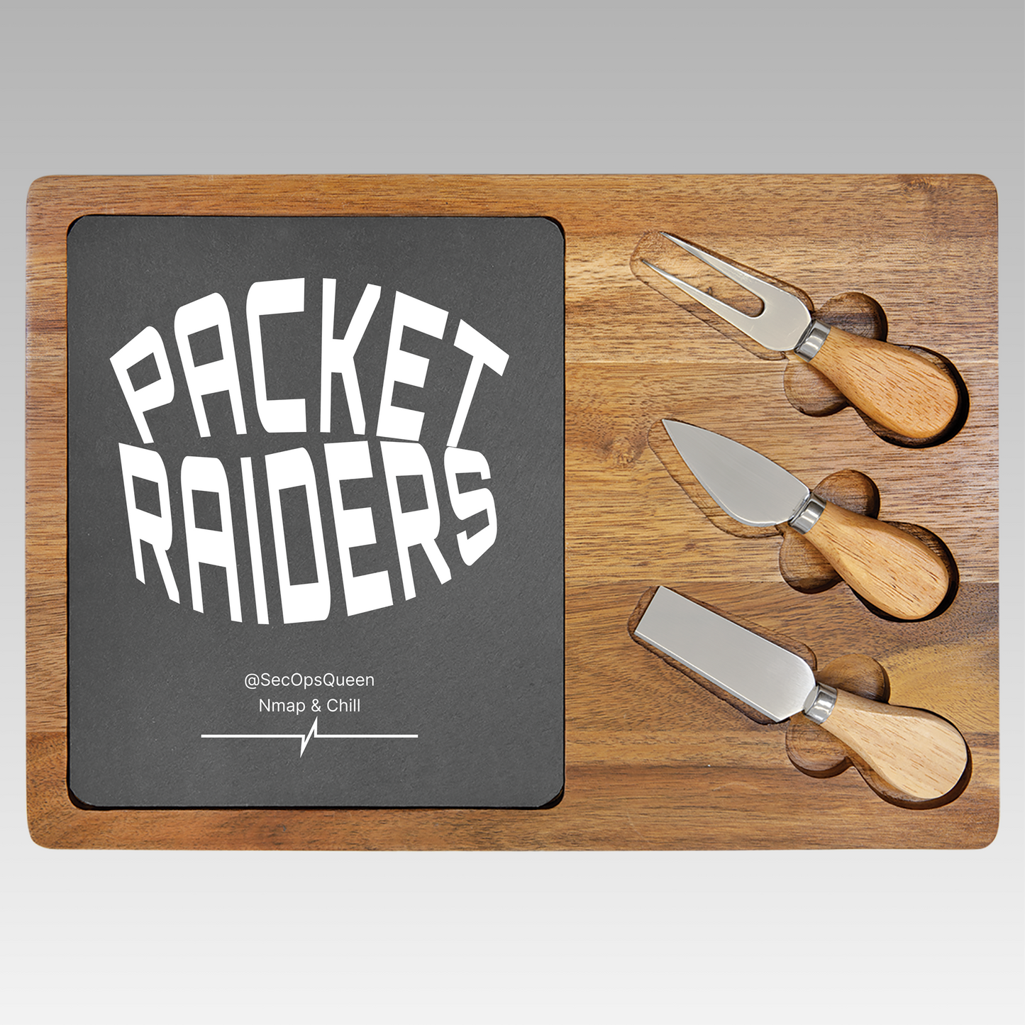Customizable square wooden charcuterie board with 'Packet Raiders' sign and cheese knives on a gray background