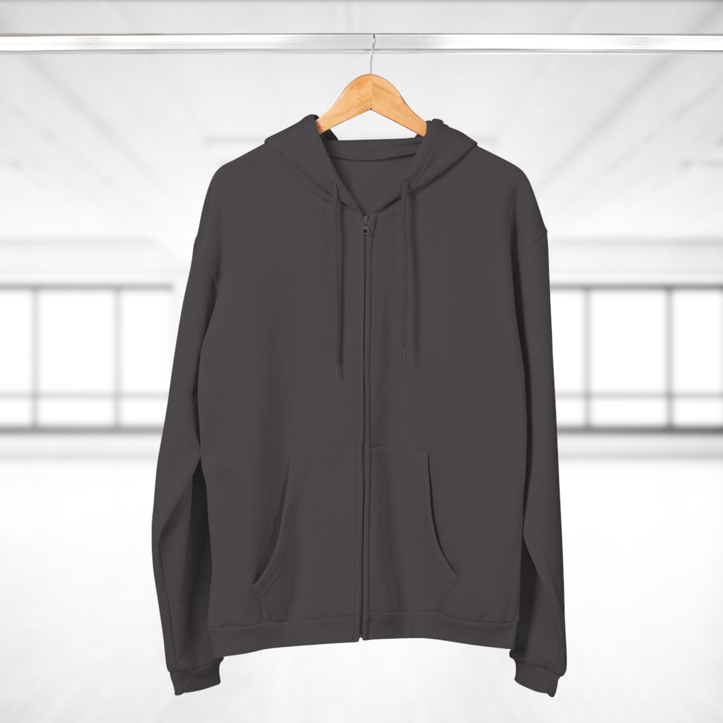 Gray hoodie on a wooden hanger against a white background