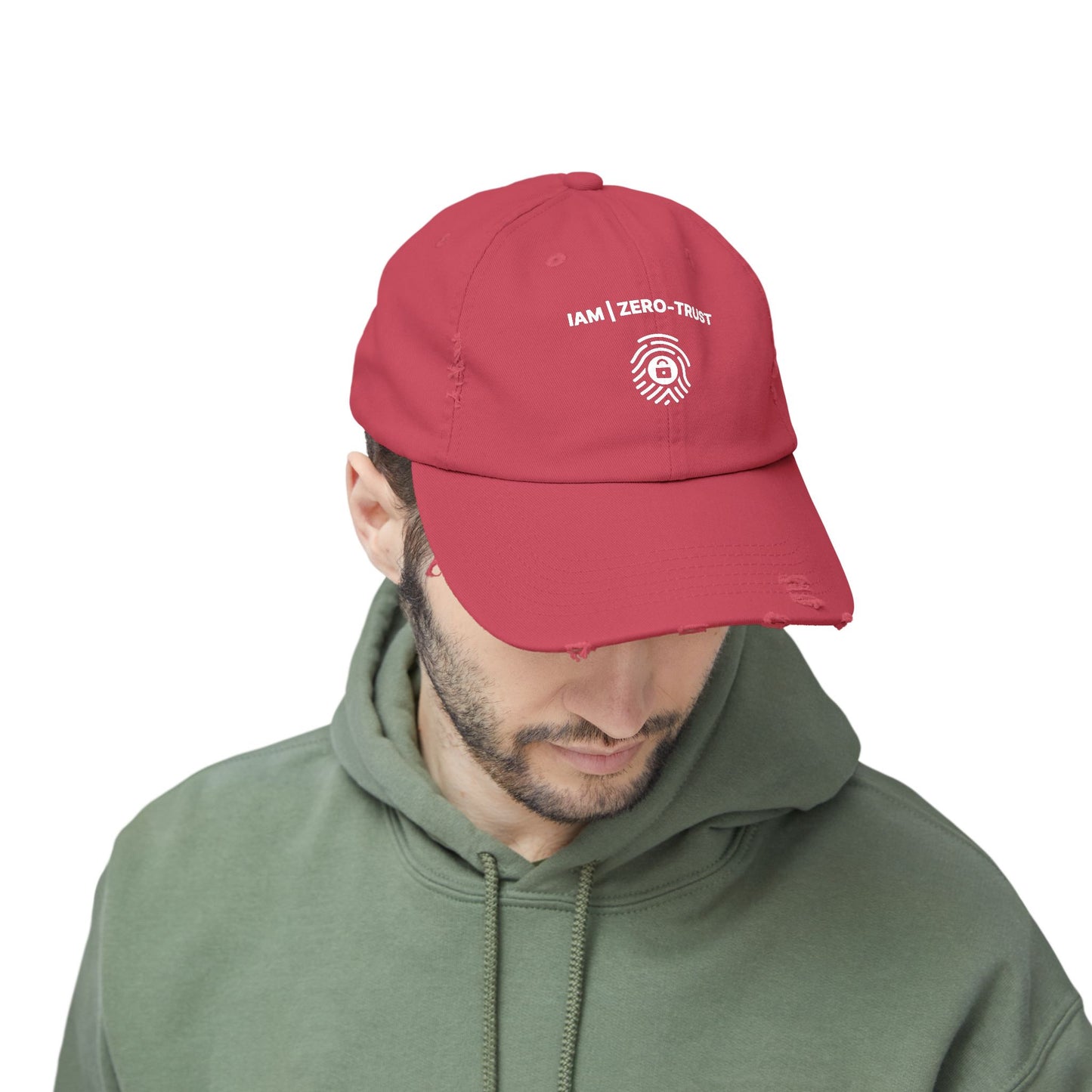 Man wearing a red cap with white text and logo on a white background