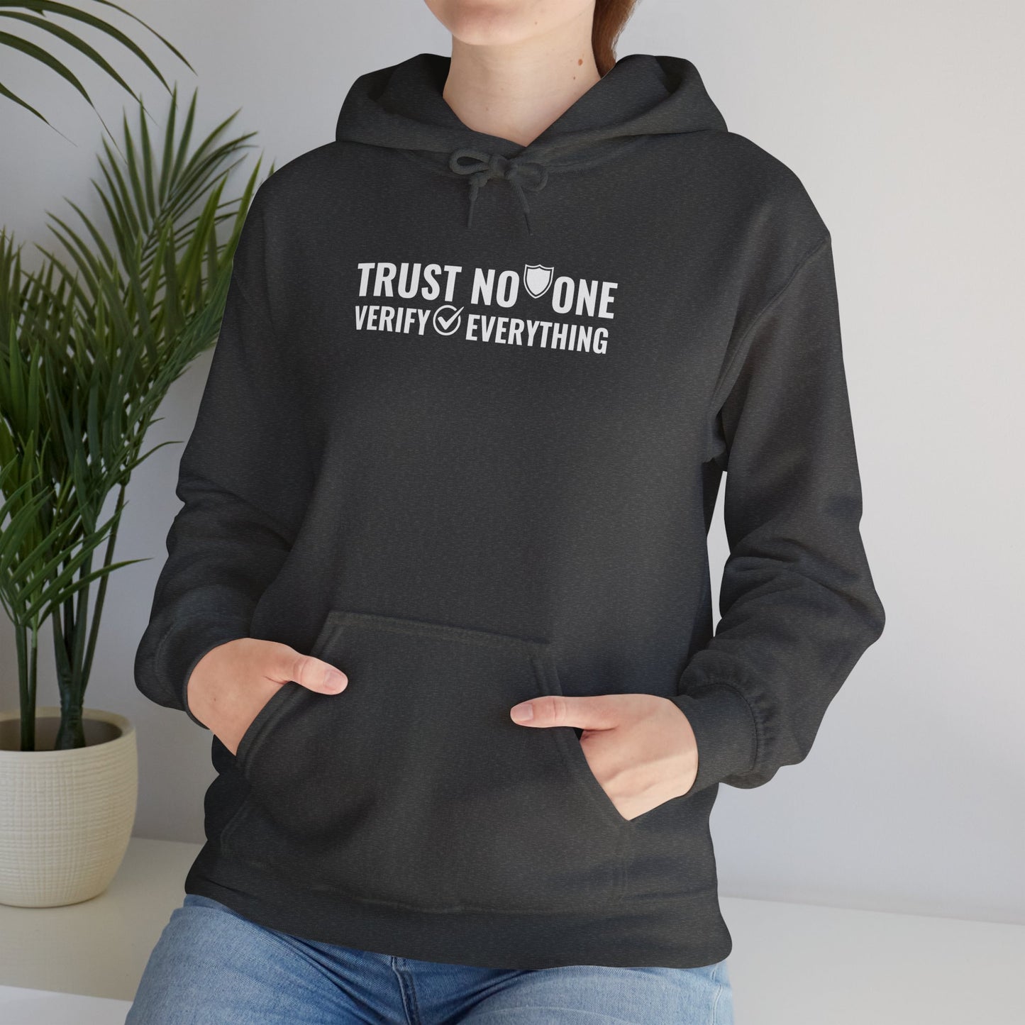 Cybersecurity hoodie in Dark Heather on model, 'Trust No One, Verify Everything' slogan for IT professionals.